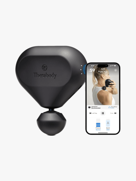 Theragun Mini in black colorway with iphone showing partner app on light gray background